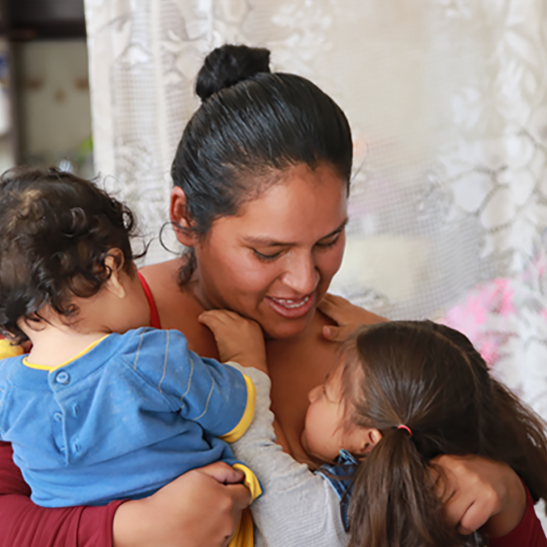 A mother hugging her children in Bolivia