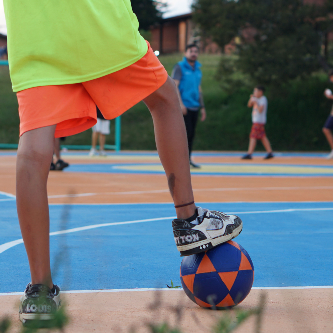 A group of children playing soccer in Colombia.