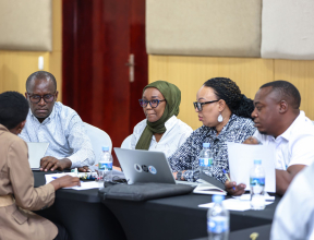 photo of people around a desk