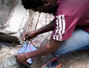 youth in Ethiopia training as a solar panel technician