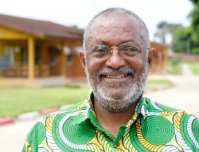 Raphael Adou standing in front of his former SOS home.