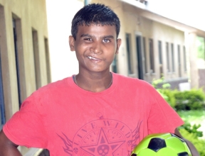 Buddy posing with a soccer ball