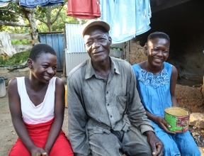 Nyaaba and two of his daughters pose for a picture.