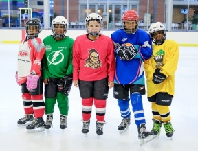 SOS kids in full equipment before hockey practice