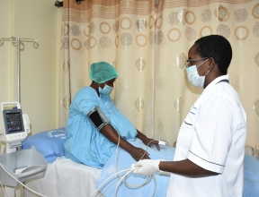 Norah taking care of a mother at her medical centre.