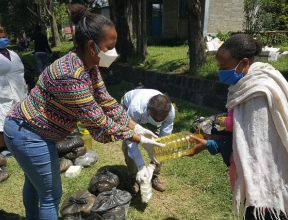 SOS workers distribute relief packages to needy recipients.