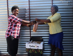 Sanna selling fresh bread to a customer