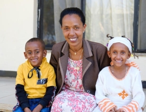 Twin siblings with their SOS mother