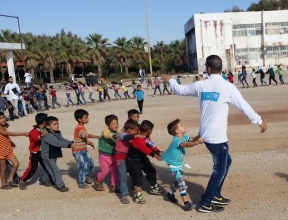 Children in a conga line in Damascus, Syria