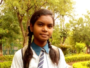 Girl in school uniform in India