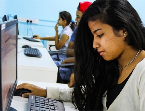Girl at computer in SOS computer lab