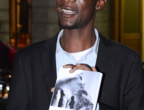 Veliano holding his book “The Mystery of an Assured Future”