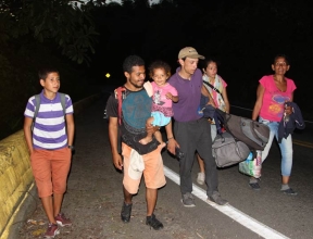 Venezuelan refugee family walking, Colombia
