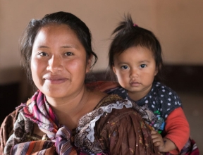 Woman carrying her baby, Guatemala