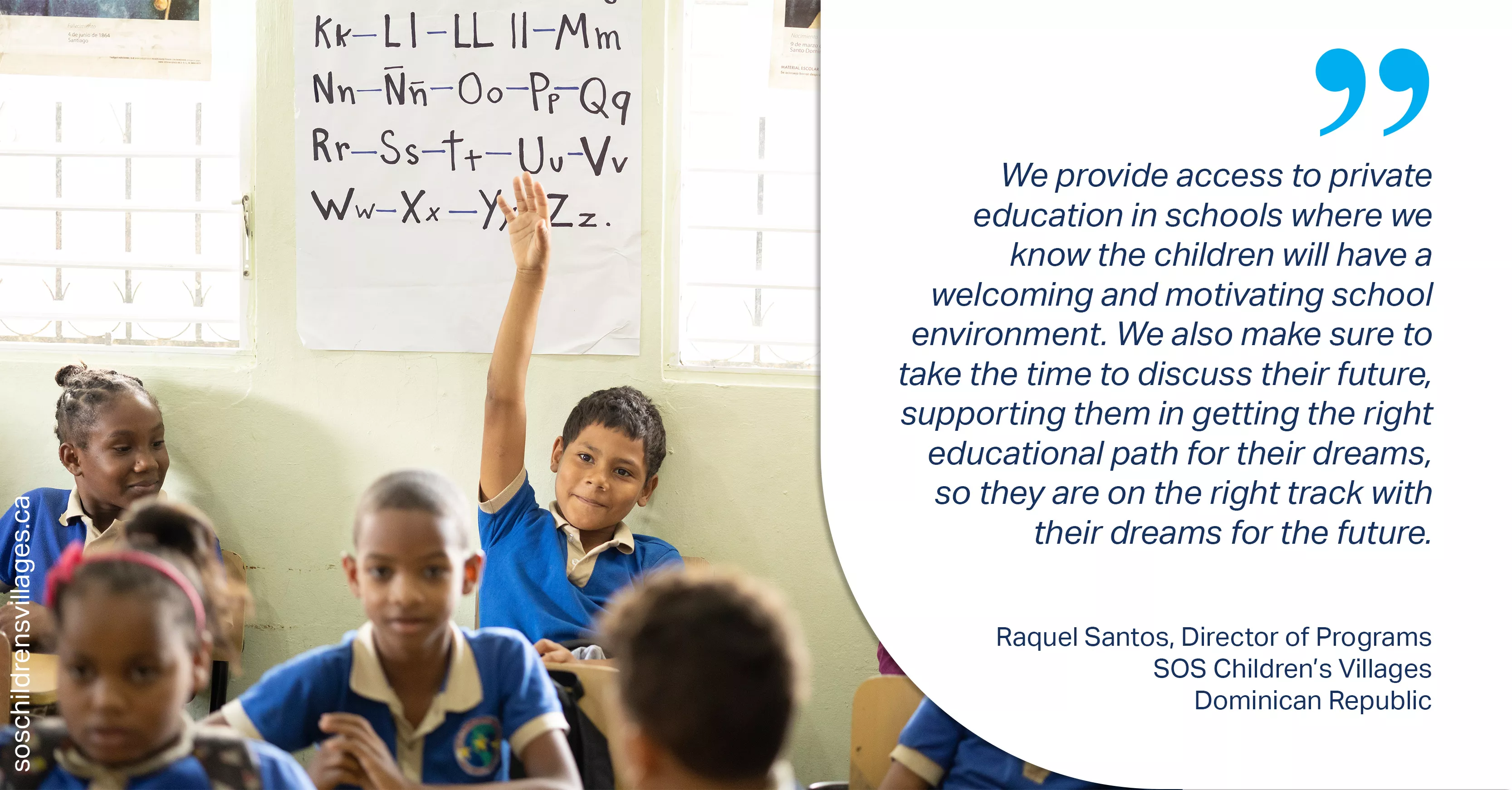 Classroom in the Dominican Republic, young boy raising hand. 