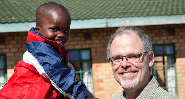 Boyd McBride in Zambia with an SOS Child