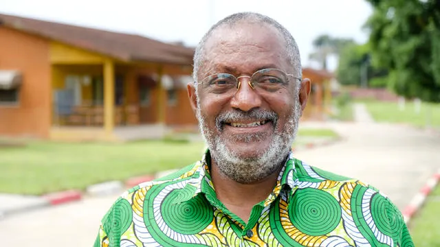 Raphael Adou standing in front of his former SOS home.