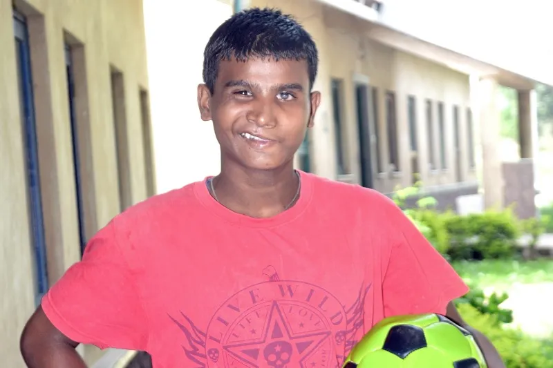Buddy posing with a soccer ball