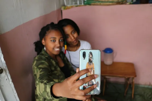 Fayo and a friend posing for a selfie.