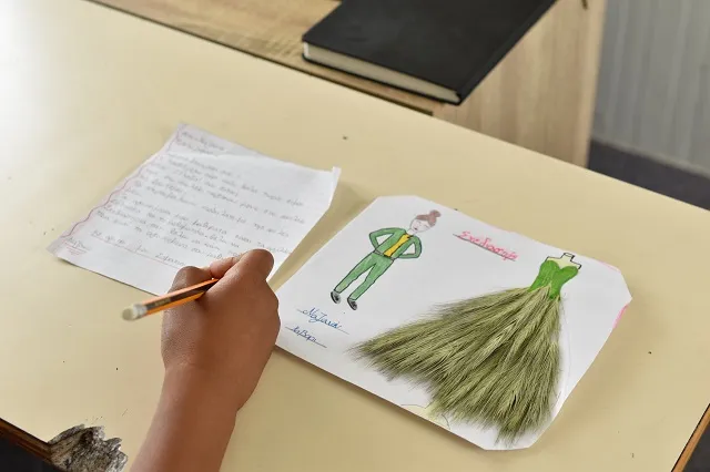 A letter being written by a child refugee.