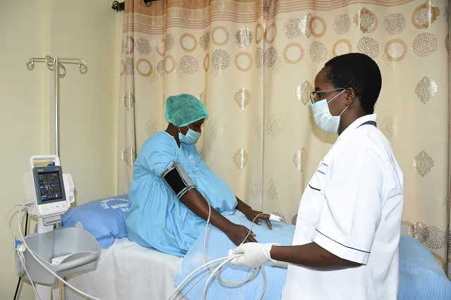 Norah taking care of a mother at her medical centre.