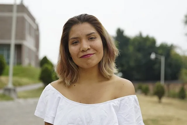 Guadalupe smiling for a photo.