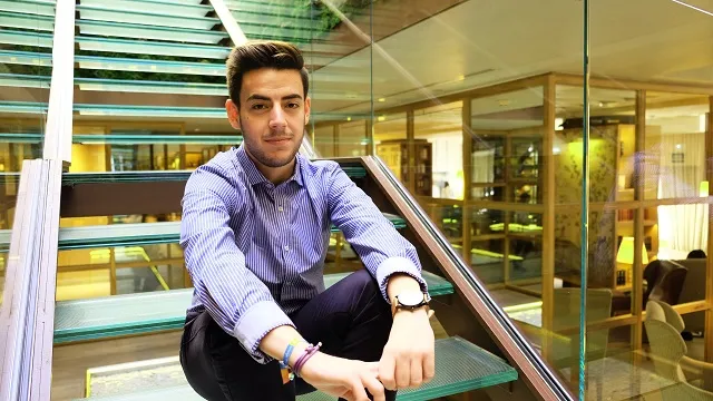 Javier on the stairs at school.