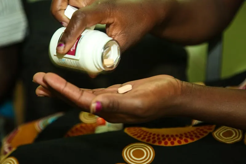 Taking medication in Kitwe, Zambia