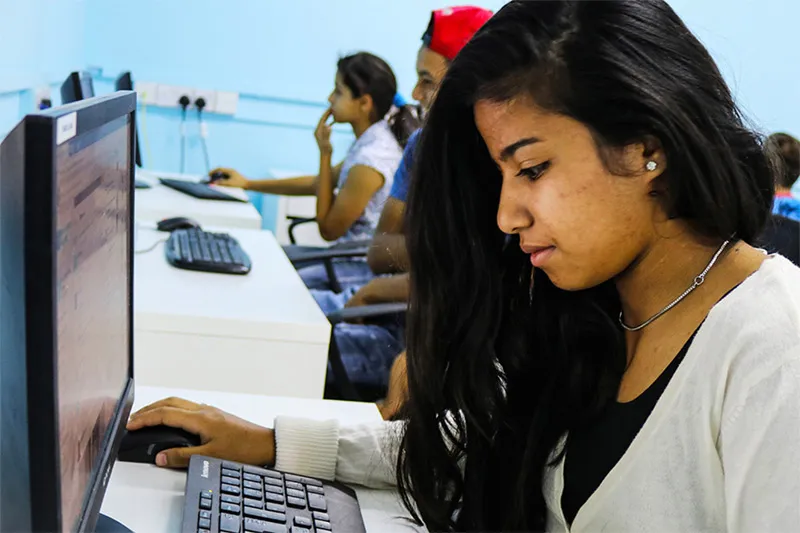 Girl at computer in SOS computer lab