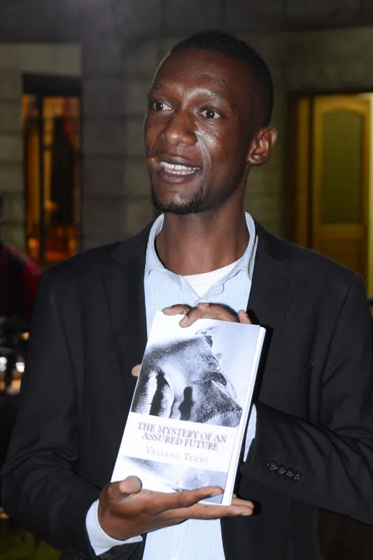 Veliano holding his book “The Mystery of an Assured Future”