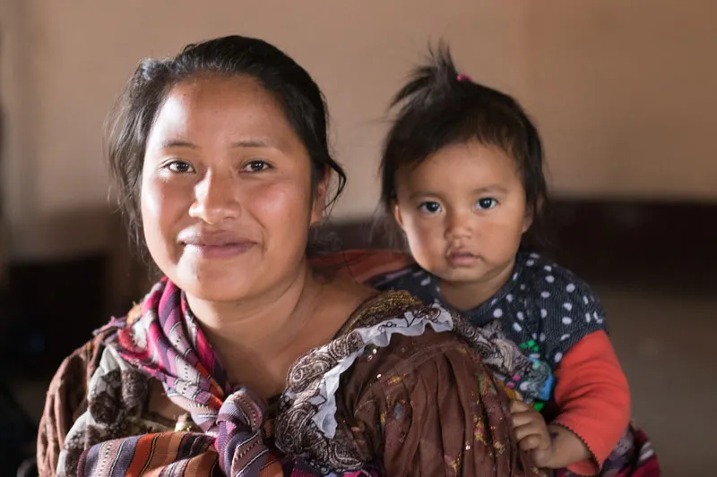 Woman carrying her baby, Guatemala