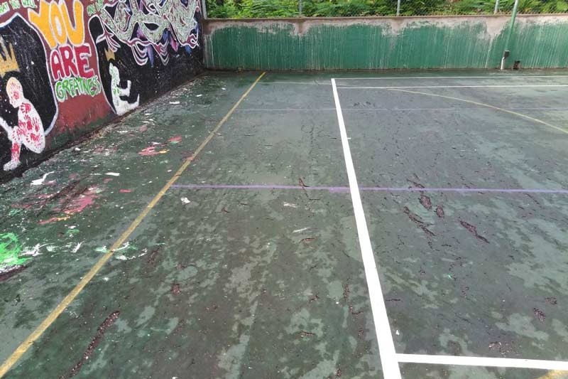 Tennis court before being repaired