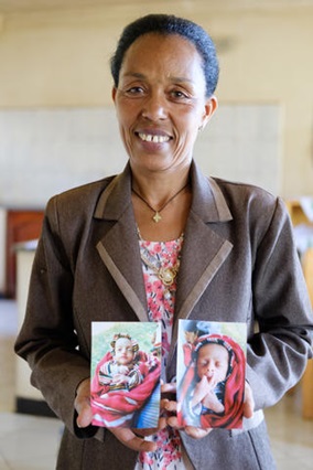 SOS mother holding early pictures of her twins