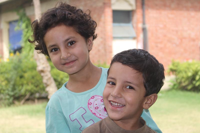 Two Pakistani children smiling