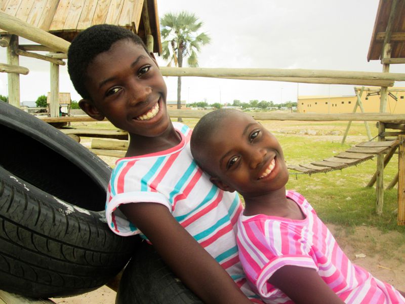 Two siblings smiling