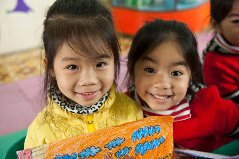 Two girls smiling in Vietnam
