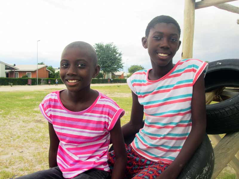 Two sisters smiling in Ondangwa, Namibia