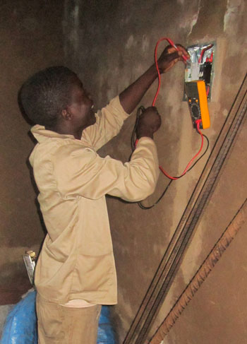 William learning to be an electrician in Malawi